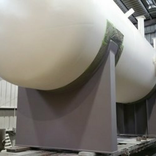 A room sized vessel has been prepared for coating by Coatech Baton Rouge. Next the tank will be sprayed externally with a gray specialized industrial coating.